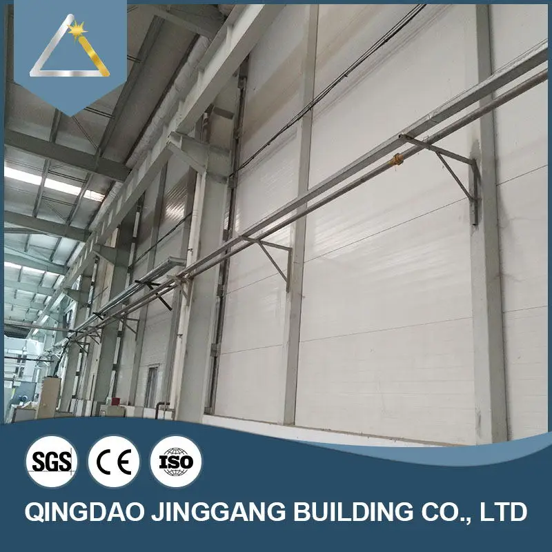 Prefab Customized Steel Structure Economical Quonset Hut Prefabricated Steel Structure Warehouse Q345 Q235 Jinggang Shutter Door